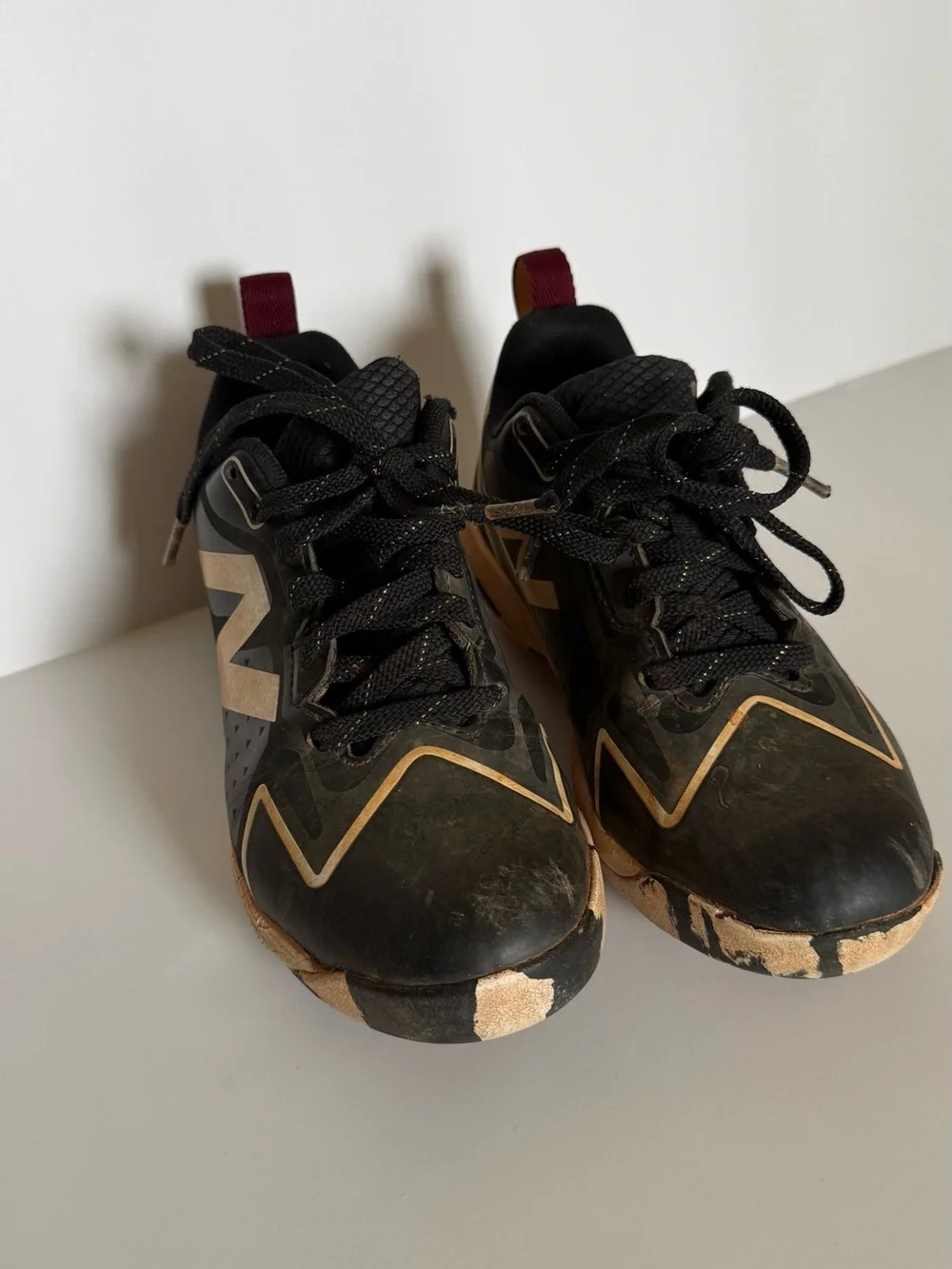 New Balance Black and white Romero Cleats